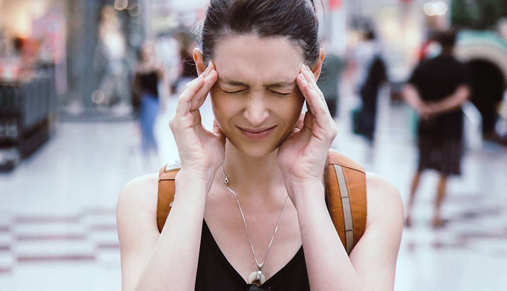 Woman experiencing inflammation stressors